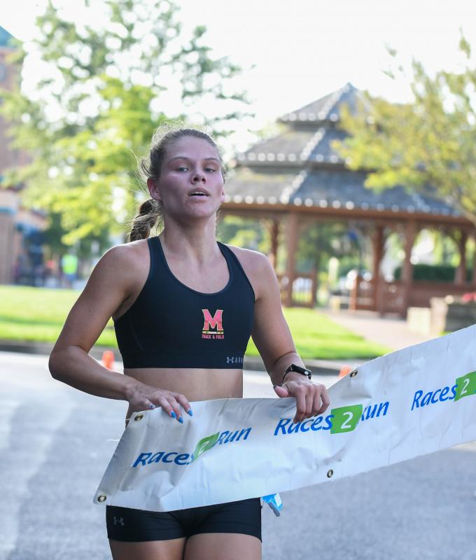 Brittany Lang, a runner for University of Maryland, grabs first in the Greene Turtle 5K, a race to benefit the Harry K Foundation. DAVE FREDERICK PHOTOS